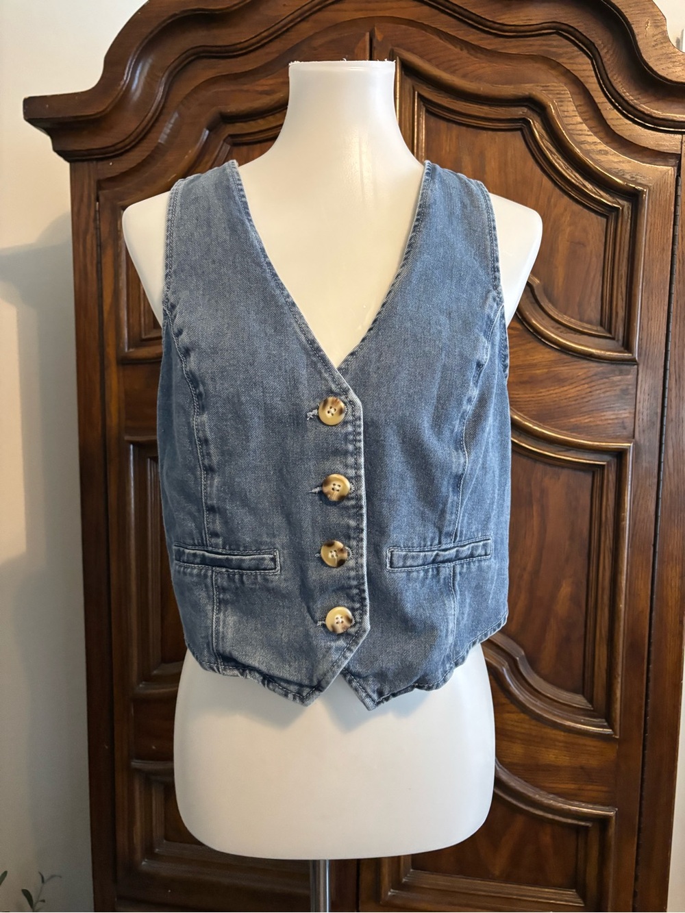 Sincerely Jules Blue denim vest with button-up front and pocket detail